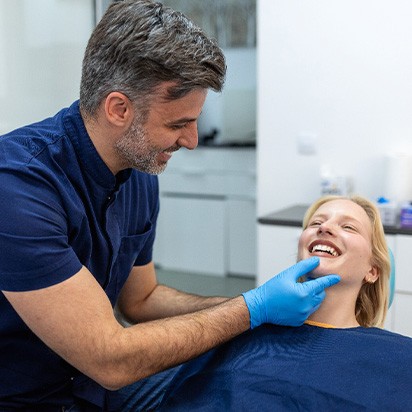 a dentist examining a patient’s mouth
