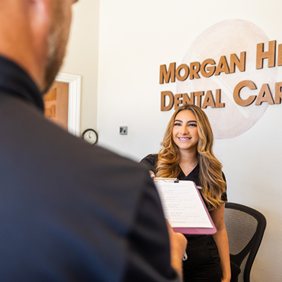 Morgan Hill Dental Care receptionist greeting a patient at front desk