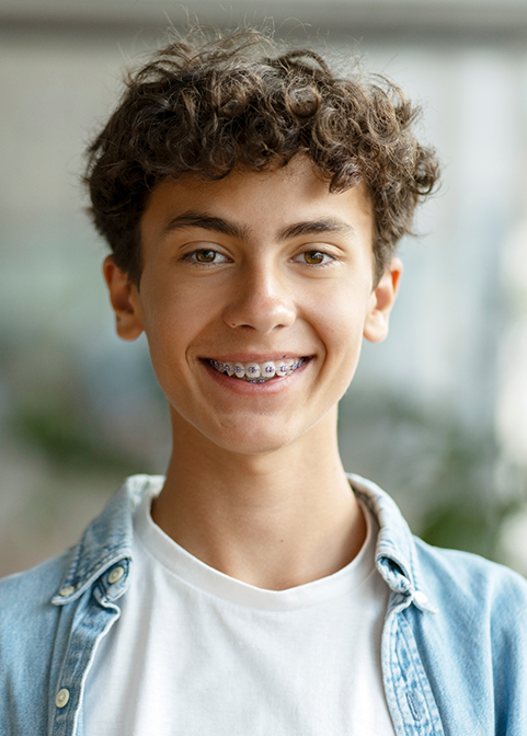 Teenage boy smiling with braces in Morgan Hill